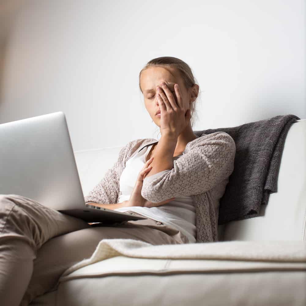 exhausted woman on sofa