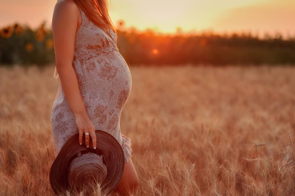 pregnant woman in field 