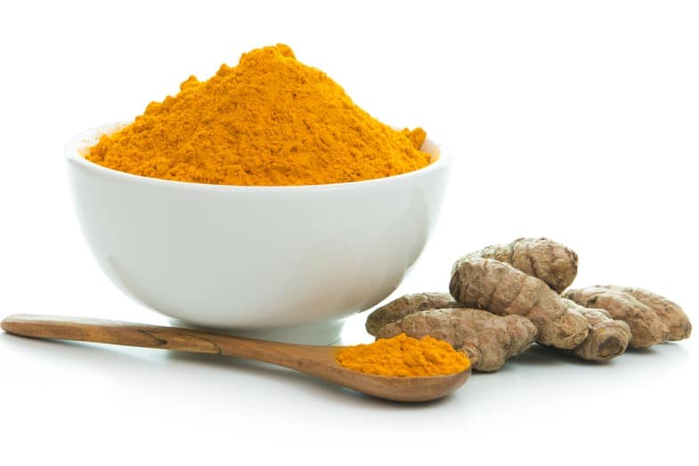 reducing inflammation body - turmeric root and powder