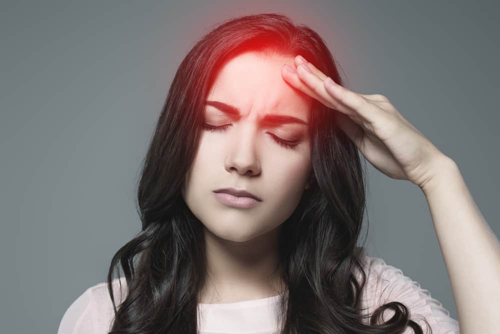 fibromyalgia fatigue treatment - woman with headache