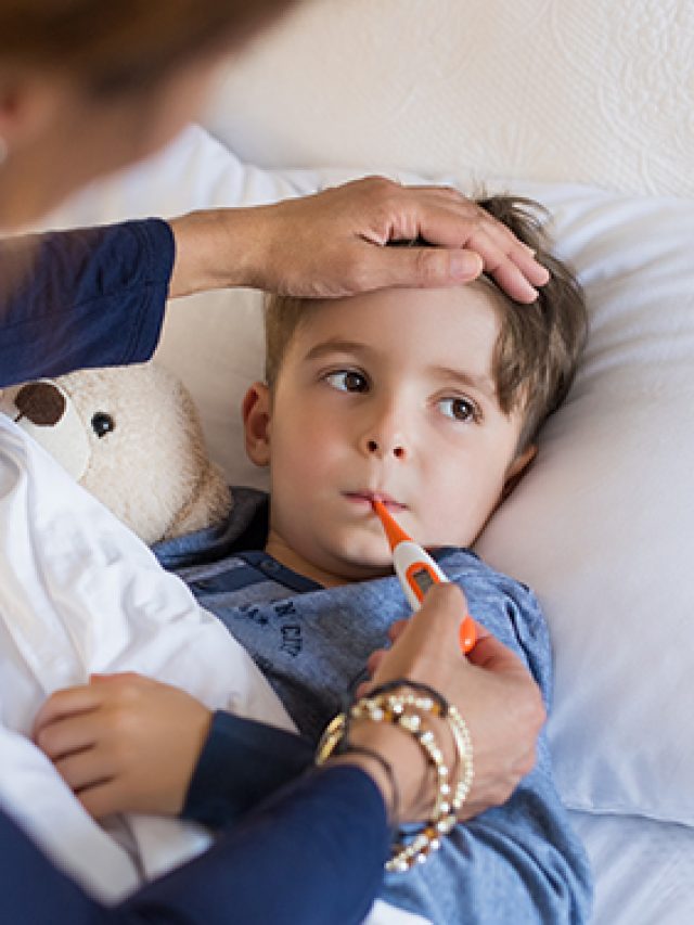 Boy measuring fever